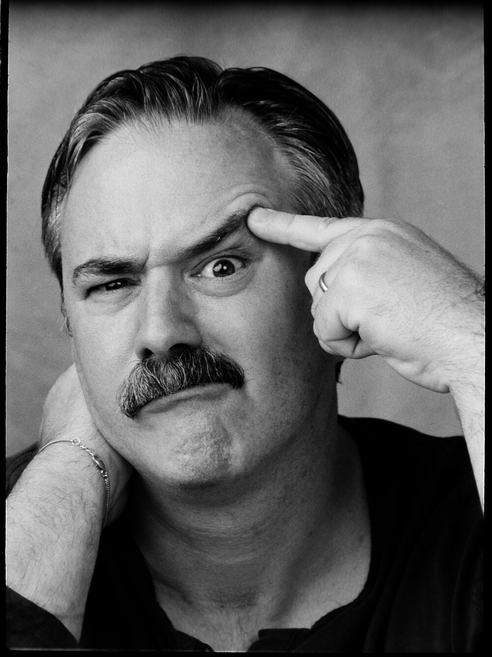 Black-and-white portrait of Guy Olivieri
