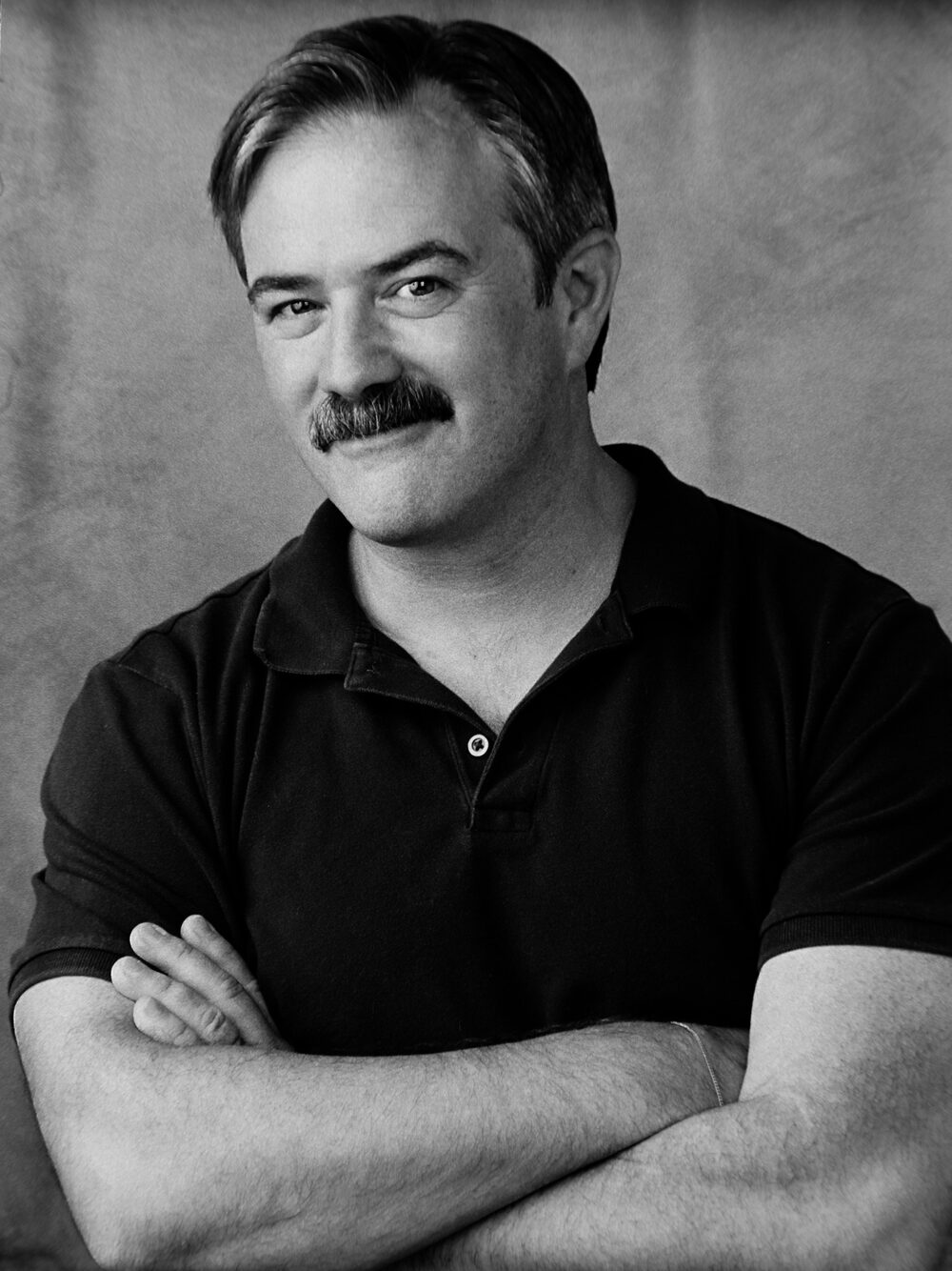 Black-and-white portrait of Guy Olivieri